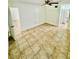 This bedroom features neutral walls, tile flooring, and a ceiling fan with light fixture at 238 Riverbend Dr # 105, Altamonte Springs, FL 32714