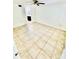 Bright bedroom features neutral tile flooring, ceiling fan and ensuite bathroom at 238 Riverbend Dr # 105, Altamonte Springs, FL 32714