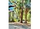 This exterior view shows the building with beautiful palm trees at 238 Riverbend Dr # 105, Altamonte Springs, FL 32714
