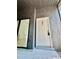 Exterior view of the unit's entrance with a white door and glass patio entrance at 238 Riverbend Dr # 105, Altamonte Springs, FL 32714