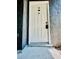 White front door with black hardware provides secure entry to the home at 238 Riverbend Dr # 105, Altamonte Springs, FL 32714