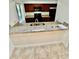 Kitchen with granite countertops, stainless steel sink, and dark wood cabinetry at 238 Riverbend Dr # 105, Altamonte Springs, FL 32714