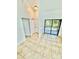 The bright living room boasts tile flooring, a sliding glass door and neutral paint at 238 Riverbend Dr # 105, Altamonte Springs, FL 32714