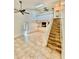Spacious living room with tile floors, skylight and staircase access to a second level at 238 Riverbend Dr # 105, Altamonte Springs, FL 32714