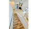 An elevated view of the staircase and living area with tile floors and a ceiling fan at 238 Riverbend Dr # 105, Altamonte Springs, FL 32714