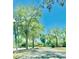 Street view with lush green trees and manicured landscaping at 238 Riverbend Dr # 105, Altamonte Springs, FL 32714