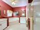 Bathroom featuring a soaking tub, a separate shower, and dual sinks at 2409 Twickingham Ct, Clermont, FL 34711