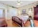 Bedroom with floral wallpaper and carpet flooring at 2409 Twickingham Ct, Clermont, FL 34711