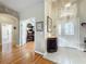 Elegant foyer with wood and tile flooring, leading to living spaces at 2409 Twickingham Ct, Clermont, FL 34711