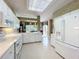 Bright kitchen showcases white appliances, ample countertop space, and a breakfast area with scenic views at 2409 Twickingham Ct, Clermont, FL 34711