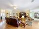 Bright living area with hardwood floors and comfortable seating at 2409 Twickingham Ct, Clermont, FL 34711