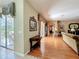Bright open concept with sliding glass door, hardwood floors, and decorative accents at 2409 Twickingham Ct, Clermont, FL 34711