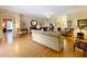Open concept living room with hardwood floors and views into adjoining rooms at 2409 Twickingham Ct, Clermont, FL 34711