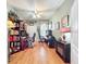 Home office with dual workstations, built-in bookshelves, and ample lighting at 2409 Twickingham Ct, Clermont, FL 34711
