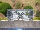 Aerial view of a screened patio featuring outdoor seating, plants, and an overhead view of solar panels at 2409 Twickingham Ct, Clermont, FL 34711
