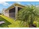 Side view of the screened in porch with adjacent landscaping at 2789 Southland St, St Cloud, FL 34772