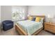 Bright bedroom with neutral decor, wooden furniture, and a comfortable, inviting space at 2789 Southland St, St Cloud, FL 34772