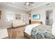 Bedroom features a TV, ceiling fan, and a king size bed at 2789 Southland St, St Cloud, FL 34772