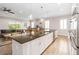 Bright and spacious kitchen features an island, pendant lighting, and stainless steel appliances at 2789 Southland St, St Cloud, FL 34772