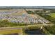Aerial view showcasing the neighborhood's layout, landscaping, nearby roads and bodies of water at 2789 Southland St, St Cloud, FL 34772