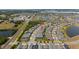 Aerial view showing the neighborhood, nearby lakes, and landscaping at 2789 Southland St, St Cloud, FL 34772