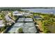 Aerial shot of the tennis courts along with the community clubhouse, swimming pool, and parking at 2789 Southland St, St Cloud, FL 34772