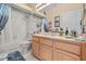 Standard bathroom showing a vanity with sink, toilet, and tub/shower combination with neutral decor at 2808 Osprey Cove Pl # 201, Kissimmee, FL 34746