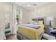 Well-lit bedroom with a comfortable bed, bedside table, and window with natural light at 2808 Osprey Cove Pl # 201, Kissimmee, FL 34746