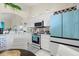 Modern kitchen with white cabinets, updated appliances, and breakfast bar at 2808 Osprey Cove Pl # 201, Kissimmee, FL 34746