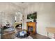 Living room featuring a fireplace, TV, and an adjacent bedroom at 2808 Osprey Cove Pl # 201, Kissimmee, FL 34746
