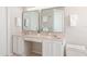 Bathroom featuring a double vanity, soft lighting and neutral walls and countertops at 2884 Picadilly Cir, Kissimmee, FL 34747