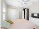 Bright bedroom featuring neutral walls and carpet, ceiling fan, and ample storage space at 2884 Picadilly Cir, Kissimmee, FL 34747