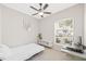 Bedroom with modern decor, natural light and ceiling fan at 2884 Picadilly Cir, Kissimmee, FL 34747