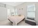Cozy bedroom with soft lighting, comfortable bed, and ample natural light at 2884 Picadilly Cir, Kissimmee, FL 34747