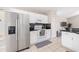Bright kitchen featuring stainless steel appliances, ample cabinet space, and a modern backsplash at 2884 Picadilly Cir, Kissimmee, FL 34747