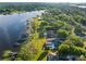 A beautiful waterfront property with a private dock, a pool and lush green lawns at 2926 Marquesas Ct, Windermere, FL 34786
