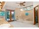 Elegant bathroom featuring a soaking tub, tile surround, and access to a private outdoor space at 2926 Marquesas Ct, Windermere, FL 34786