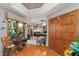 Welcoming entryway showcasing a hardwood floor, ornate sewing table, and a glimpse into the game room at 2926 Marquesas Ct, Windermere, FL 34786