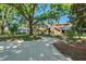 Charming home featuring mature trees, landscaped yard, and a circular driveway at 2926 Marquesas Ct, Windermere, FL 34786