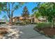 Well-maintained home with lush landscaping, mature trees, and a welcoming driveway at 2926 Marquesas Ct, Windermere, FL 34786