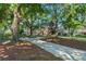 Beautiful home exterior with a long, winding driveway and mature, mossy trees at 2926 Marquesas Ct, Windermere, FL 34786