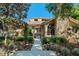 Inviting front entrance with stone accents, lush landscaping, and a walkway at 2926 Marquesas Ct, Windermere, FL 34786