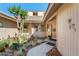 Charming home entrance with a garden featuring a bench, colorful plants, and a welcoming double-door entryway at 2926 Marquesas Ct, Windermere, FL 34786