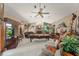 Spacious game room featuring a pool table, fireplace, large windows, and unique nautical decor at 2926 Marquesas Ct, Windermere, FL 34786