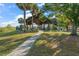 Scenic view of the park pavilion, featuring picnic tables and lush green surroundings, perfect for outdoor gatherings at 2926 Marquesas Ct, Windermere, FL 34786