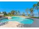 Relax by the in-ground pool with stunning views of the lake and lush backyard at 2926 Marquesas Ct, Windermere, FL 34786