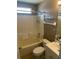 Cozy bathroom with shower-tub combination and vanity with sink and countertop space at 314 Casterton Cir, Davenport, FL 33897