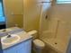 Bathroom with shower-tub combination and vanity with white cabinets and light countertop at 314 Casterton Cir, Davenport, FL 33897