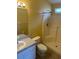 Clean bathroom with a shower, toilet, and sink with countertop space at 314 Casterton Cir, Davenport, FL 33897