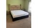 Cozy bedroom with a traditional wooden bed frame and matching nightstands at 314 Casterton Cir, Davenport, FL 33897